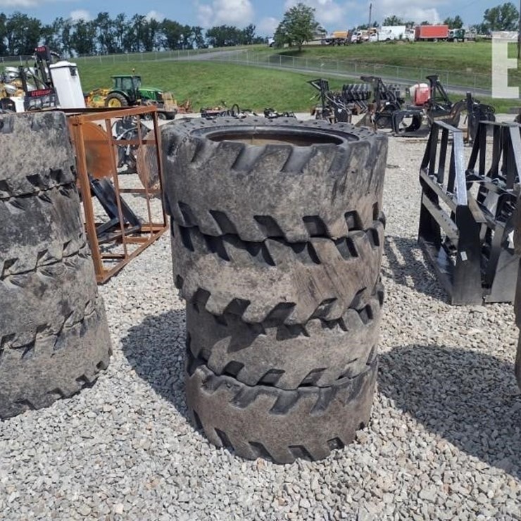 (4) 33X12-20 SOLID TIRES W/RIMS