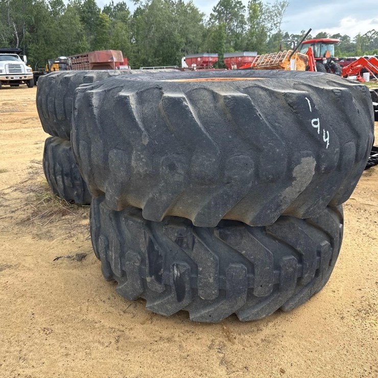 194 - 4 - 20.5 - 25 TIRES ON 12 LUG RIMS