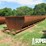 (8-9)-4'7"h-x-10'w-x-40'l-half-round-steel-mud-tan-image-1