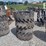 (4)-33x12-20-solid-tires-w/rims-image-1