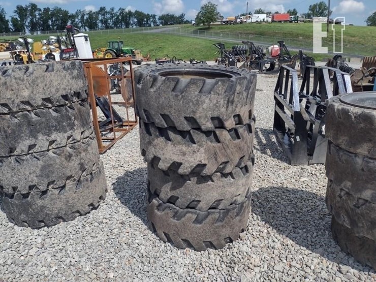 (4)-33x12-20-solid-tires-w/rims-image-1