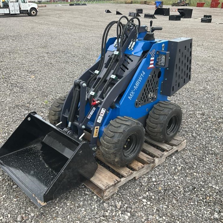 #1040 • Used 4 Wheel Mini Skid Loader