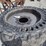 (4)-12-16.5-solid-tires-w/rims-image-2