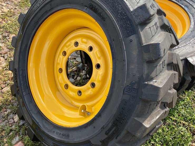4-brand-new-265/70-16.5-skidloader-tires-&-rims-image-2