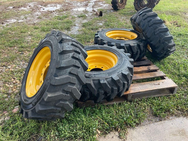 4-brand-new-265/70-16.5-skidloader-tires-&-rims-image-1