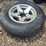 15”-tire-on-6-bolt-rim,-off-a-ice-castle-fish-house,-*needs-a-new-tire-image-1