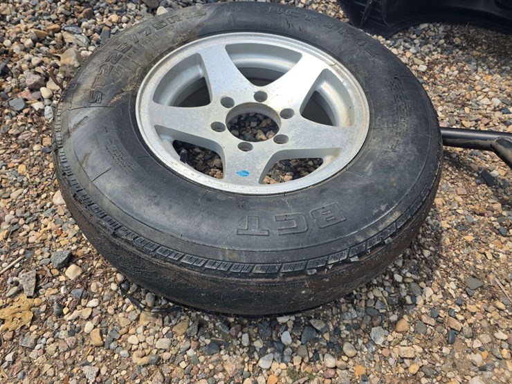 15”-tire-on-6-bolt-rim,-off-a-ice-castle-fish-house,-*needs-a-new-tire-image-1