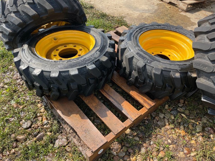 4-brand-new-265/70-16.5-skidloader-tires-&-rims-image-3