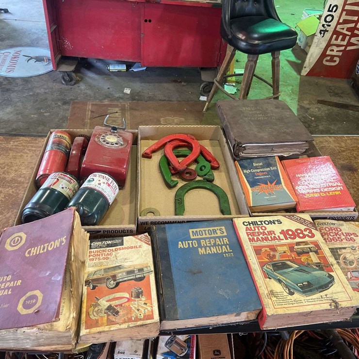 Assorted Manuels, Horseshoes, and Phone