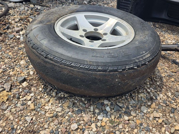 15”-tire-on-6-bolt-rim,-off-a-ice-castle-fish-house,-*needs-a-new-tire-image-2