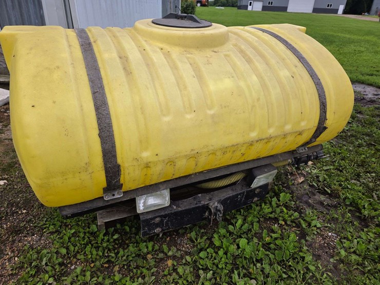 300-gallon-poly-tank-with-front-mount-saddle-with-brackets,-came-off-ih-7130-tractor-image-1