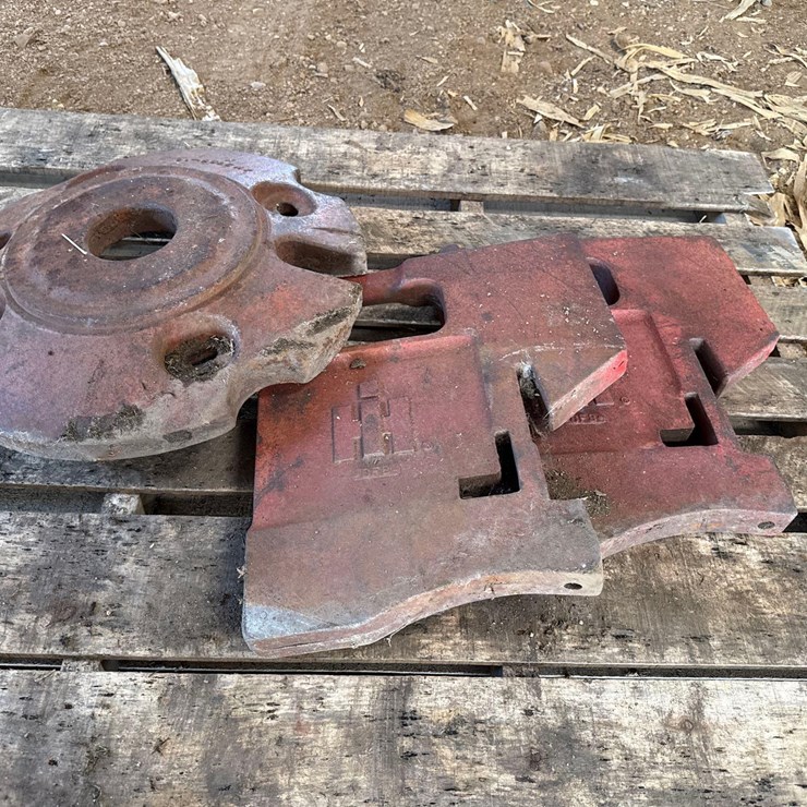 2 IH stamped suitcase weights and a wheel weight