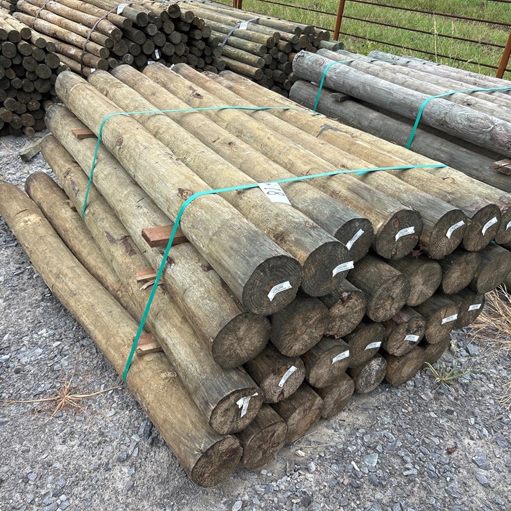 #18 • BUNDLE OF (28) 6”X7’ TREATED POSTS