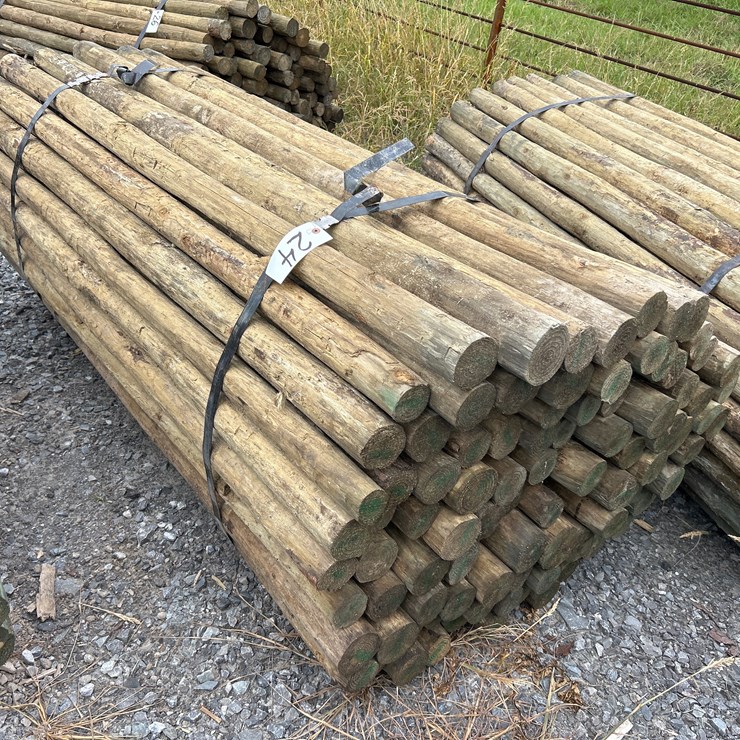 #24 • BUNDLE OF (100) 3”X7’ TREATED POSTS