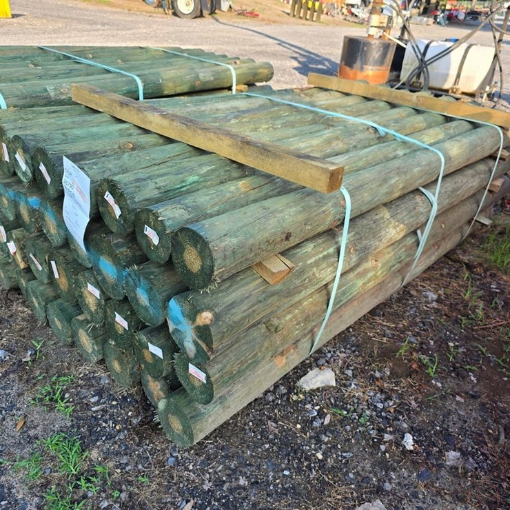 New 32-4 5/8x7 Treated Fence Posts