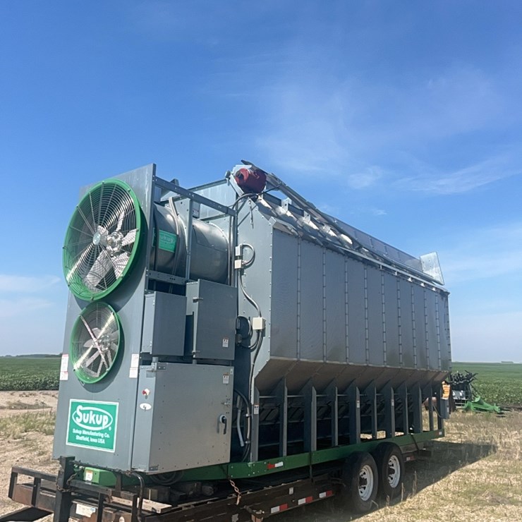 2010 Sukup 20’ 2 burner/2 fan grain dryer, 5000 BPH rating, ￼￼3 phase, excellent condition, 1,411 hours since new, fold down top, sitting on trailer, Note: Buyer can use Trailer with pre-approval. Serial# -11034