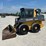 2015-deere-320e-image-1