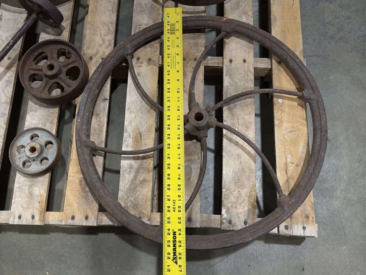 salvaged-cast-iron-wheels-of-varying-sizes-image-2