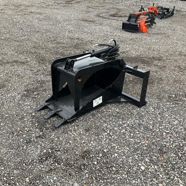#1405 • Unused Skid Steer Stump Grapple