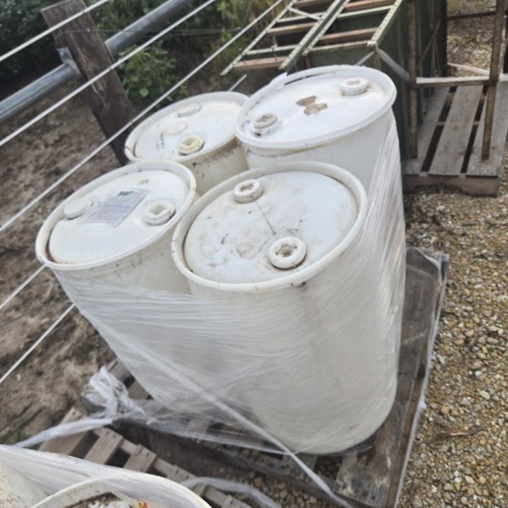 #3928 • PALLET OF 4 PLASTIC BARRELS