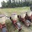 lilliston-8-row-planter-with-fiberglass-boxes,-been-sitting,-some-rust,-boxes-turn-free,-discs-need-loosened-up-image-8