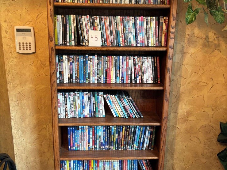 bookshelf-with-dvds---(assorted-dvd's)-the-shelf-is-82”-tall-by-36”-wide.-image-1