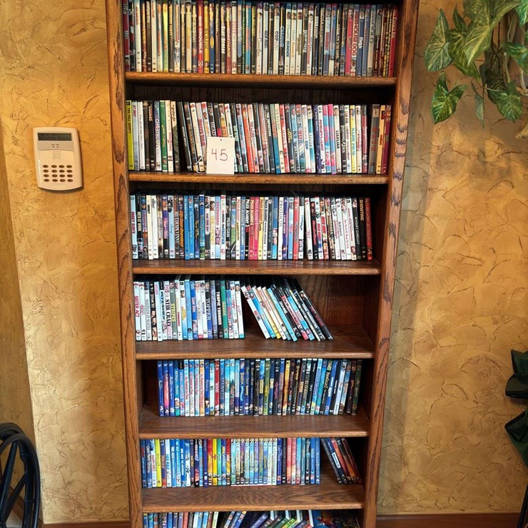 Bookshelf with DVDs - (assorted DVD's) The shelf is 82” tall by 36” wide.