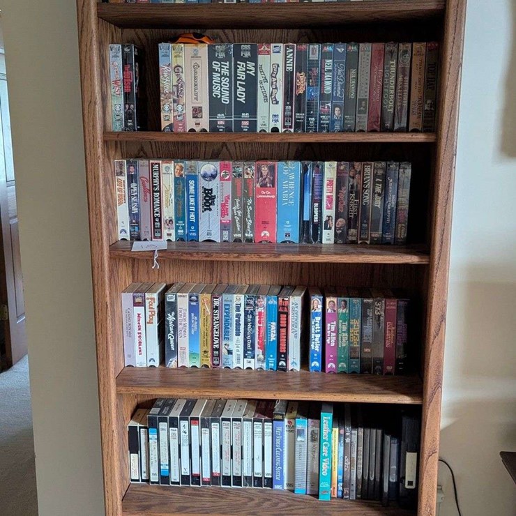Bookshelf and Contents (Assorted VHS Movies) 72” T x 30” W
