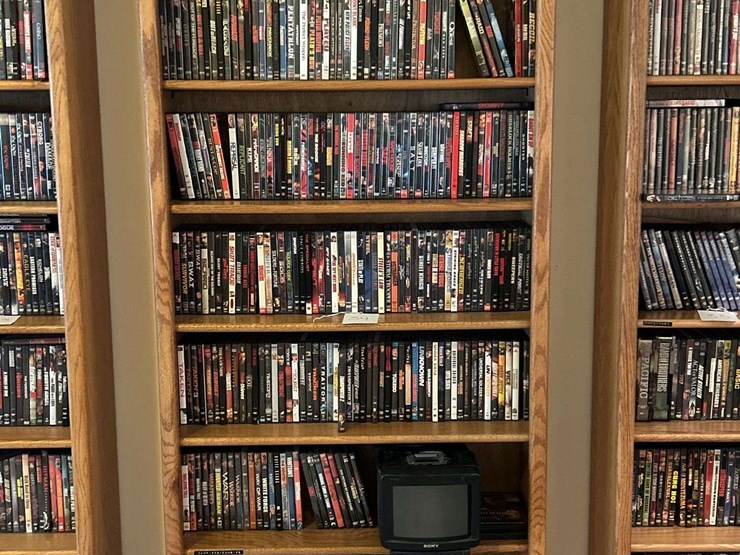 bookshelf-and-dvds,-sony-tv-dvds,-alphabetically-organized-m-through-v.-the-shelf-is-82”-tall-by-36”-wide.-image-1