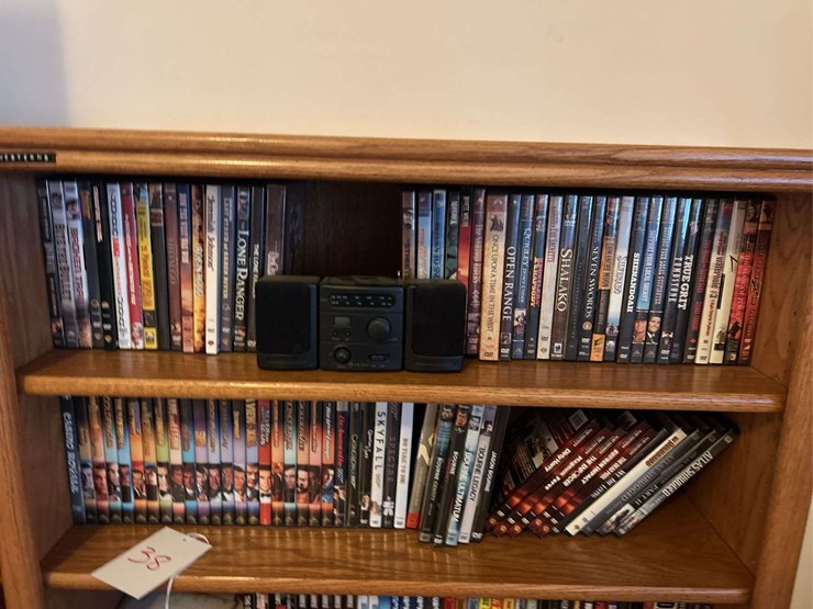 bookshelf-and-dvd’s,-small-boombox---(assorted-dvd's)-the-shelf-is-82”-tall-by-36”-wide.-image-2