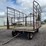#6299-•-bale-cage-on-1065-deere-running-gear-image-1