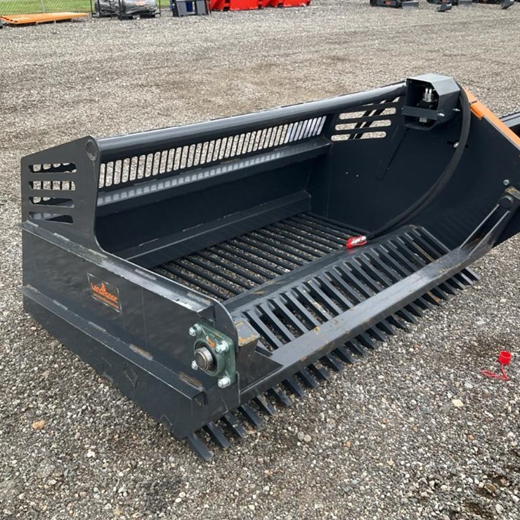 #1411 • New Skid Steer Rock Picker