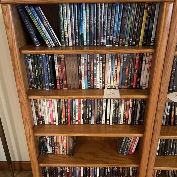Bookshelf and DVD’s (assorted DVD's) The shelf is 82” tall by 36” wide.