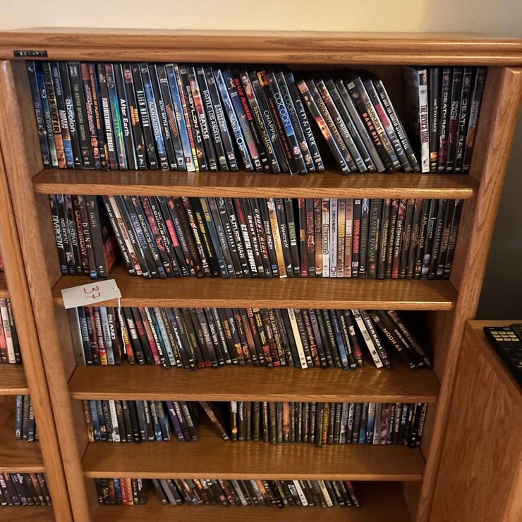 Bookshelf and DVD’s (assorted DVD's) The shelf is 82” tall by 36” wide.