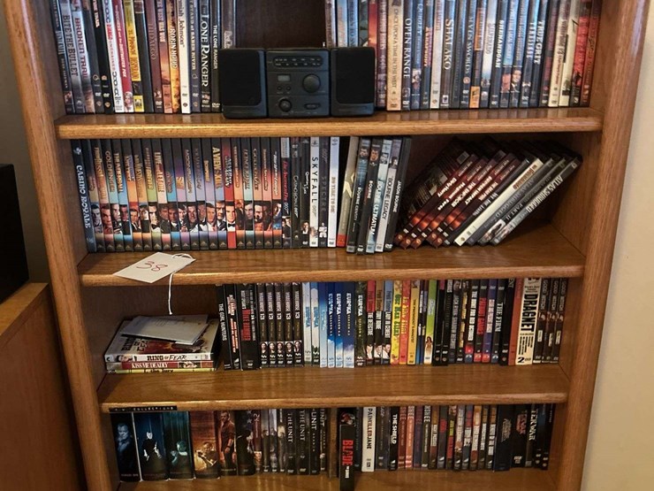 bookshelf-and-dvd’s,-small-boombox---(assorted-dvd's)-the-shelf-is-82”-tall-by-36”-wide.-image-1