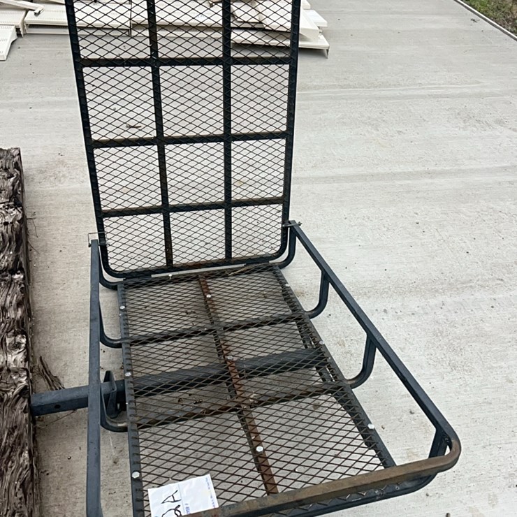 Handy carrying rack, fits into receiver hitch. Upper piece folds down to make a ramp. Would work great for three wheel electric scooter. Or, roll a truck tire on to take to town. Good shape.