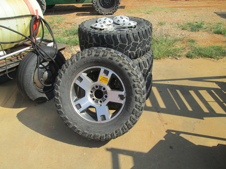 #52-•-#26826-•-lot-of-(4)-cooper-285/65r18-tires-&-ford-wheels-image-1