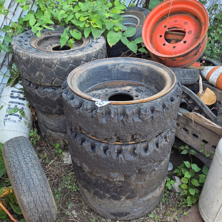 A Group of Ass't Skidsteer and Excavator Wheels