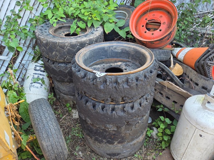a-group-of-ass't-skidsteer-and-excavator-wheels-image-1