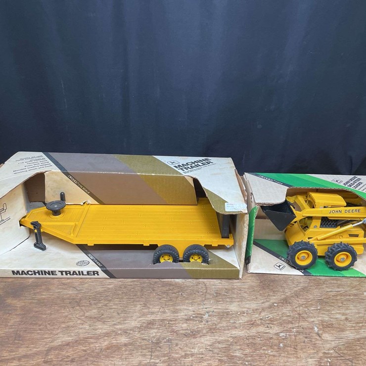 (2) 1/16 John Deere Skid Steer + Machine Trailer NIB Ertl