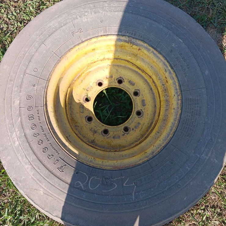 1 10.00x16 tire and rim off JD 4440, rim is partially bent