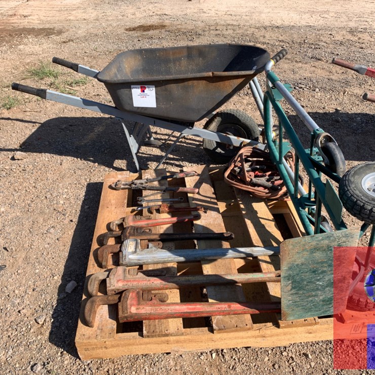PALLET OF PIPE WRENCHES, JUMPER CABLES, WHEEL DOLLY AND WHEELBARROW