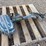 #22931-•-pallet-with-antique-3hp-evinrude-outboard-motor-image-1