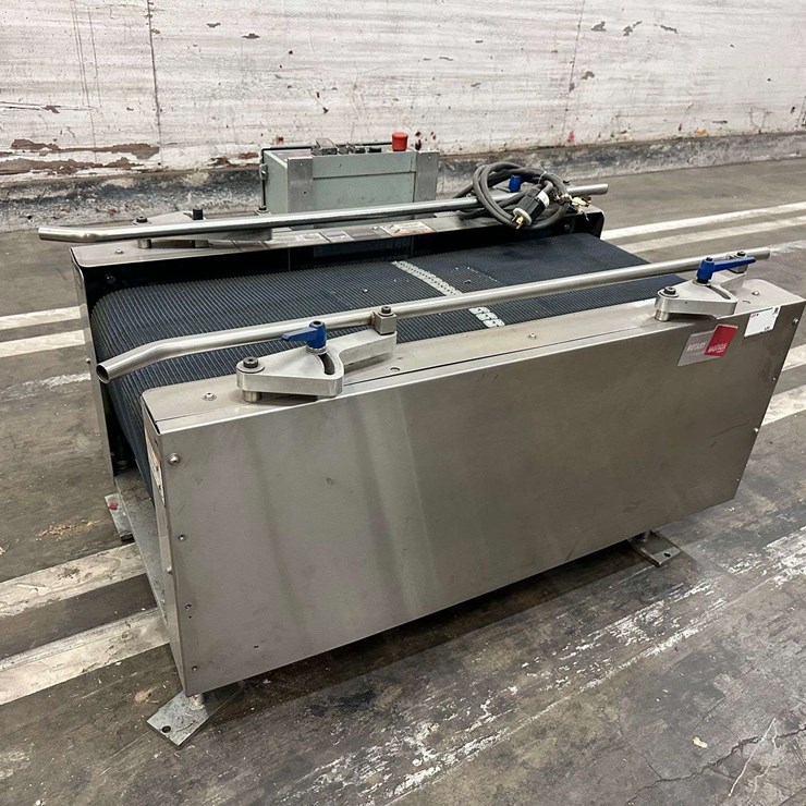 Wexxar Packaging Case Settling Conveyor- Syracuse, UT