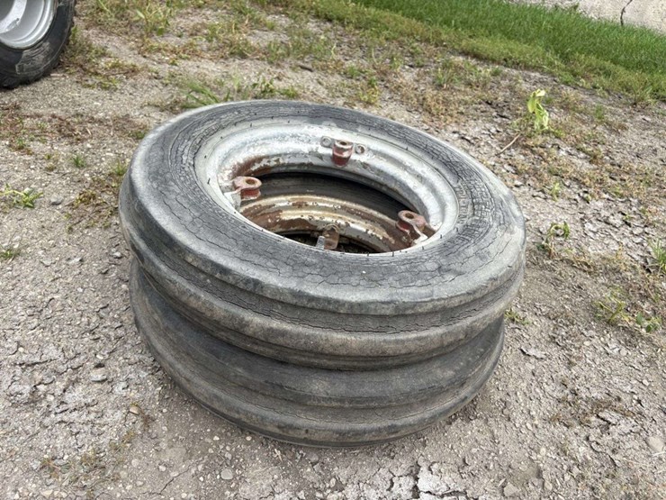 (2)-5.00-15-tires-on-farmall-front-rims,-buying-all-for-one-money-image-1