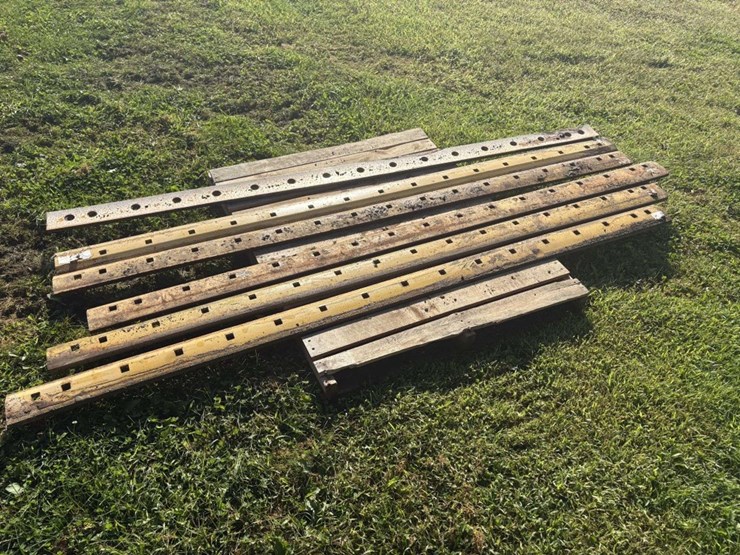 (6)-8’-used-grader-blades,-off-of-cat,-(b)-image-2