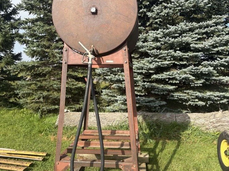 300-gal-fuel-barrel-on-stand,-last-used-for-gas-image-1