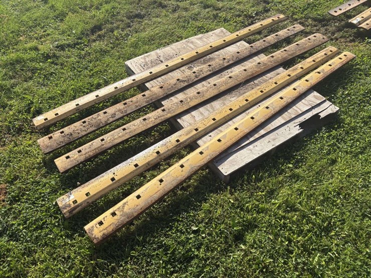 (5)-8’-used-grader-blades,-off-of-cat,-(a)-image-4