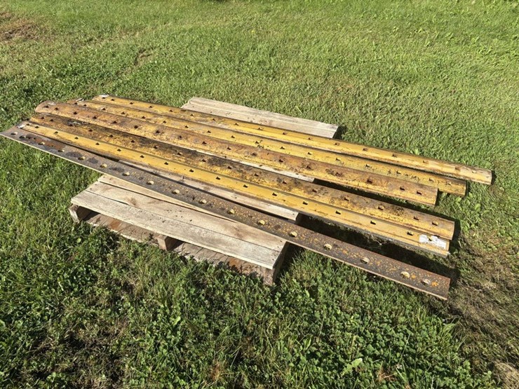 (6)-8’-used-grader-blades,-off-of-cat,-(b)-image-4