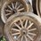 old-car-parts-including:-3-wheels-on-wood-spokes,-36x6-tire,-headlights,-windshield-image-4
